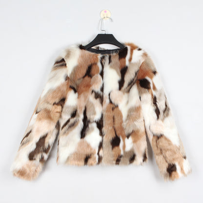 Faux fur coat with a pattern on a hanger against a white background