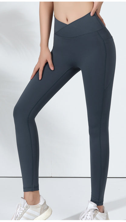 Dark gray leggings worn by a person on a white background
