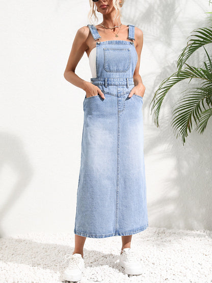 Woman wearing a light blue denim dress against a white background with a plant on the right. Women wearing tight waist strap mid-length denim dress with kurti