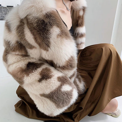 Person wearing a fur coat and brown pants on a white background