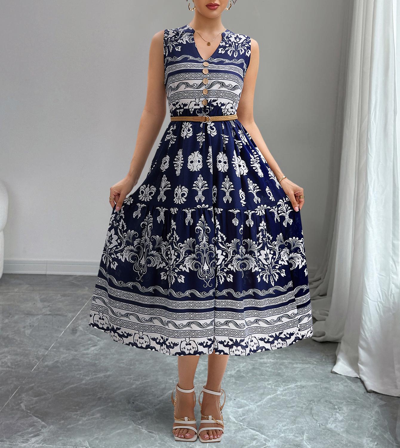 Woman wearing a blue and white patterned dress in a minimal indoor setting