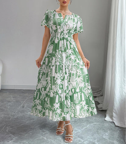 Woman wearing a green and white patterned dress in a room with gray flooring and white curtains.
