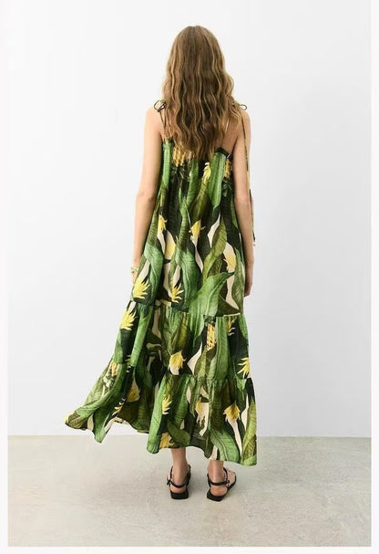 Woman wearing a green floral dress with a white background