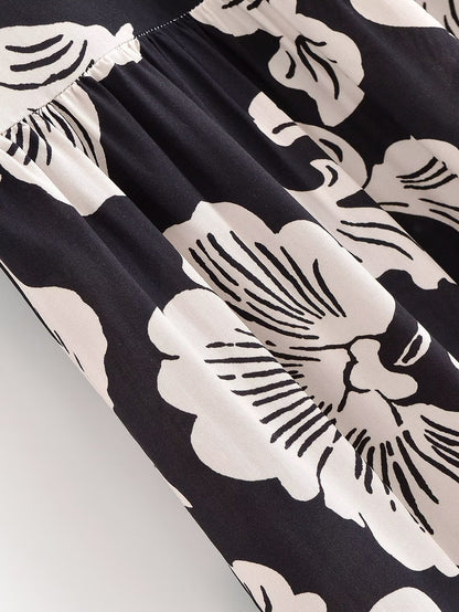 Close-up of a black fabric with white floral patterns