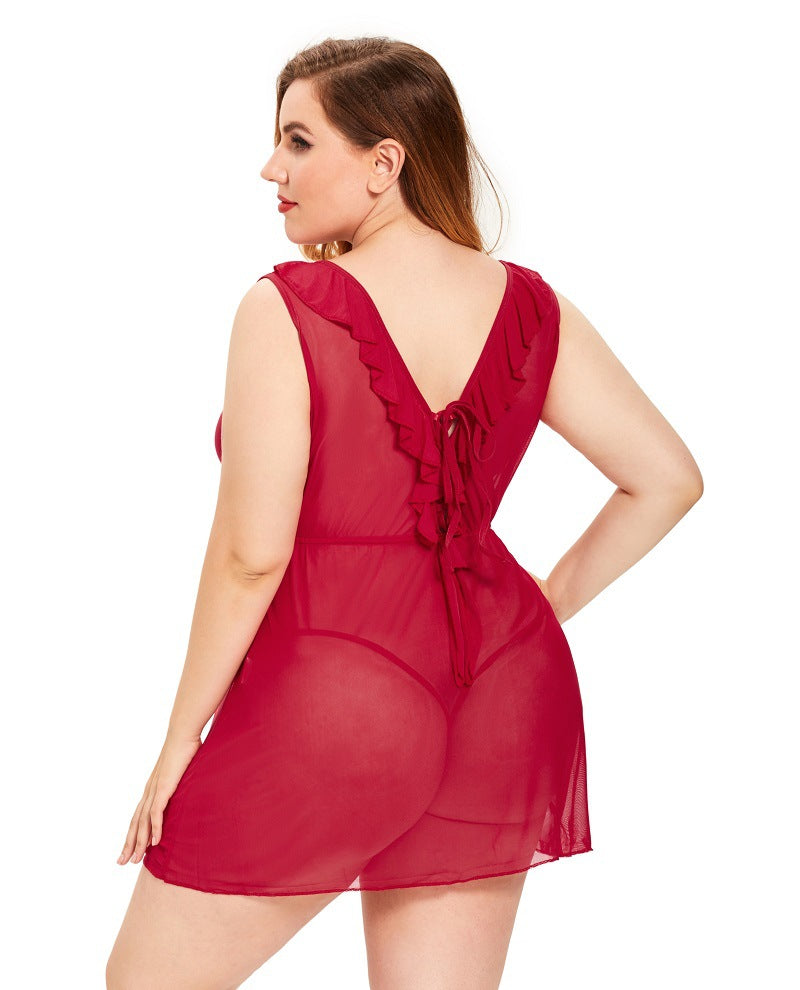 Woman wearing a red sheer dress with a white background