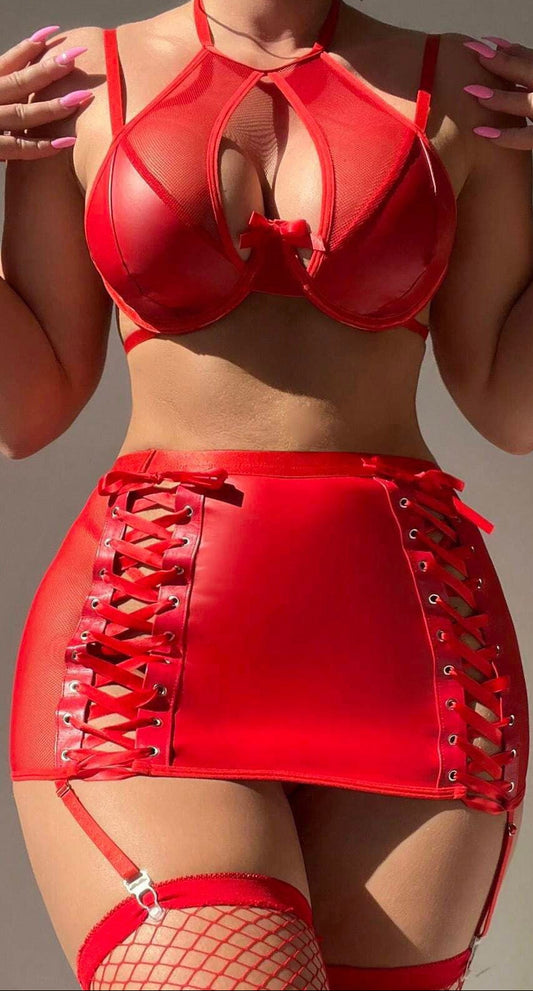 Woman wearing transparent lingerie set with leather jacket, bodycon skirt, and garter belt