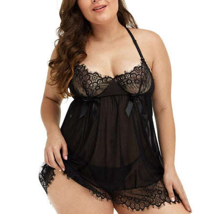 Plus size woman wearing black silk lace suspender nightdress