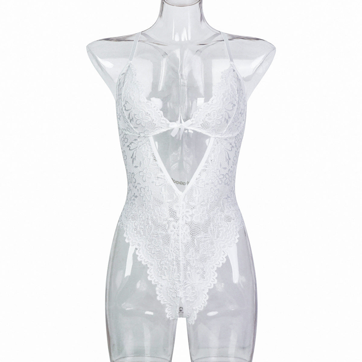 “Close-up of pearl strip detailing and lace fabric on backless sexy lingerie”
