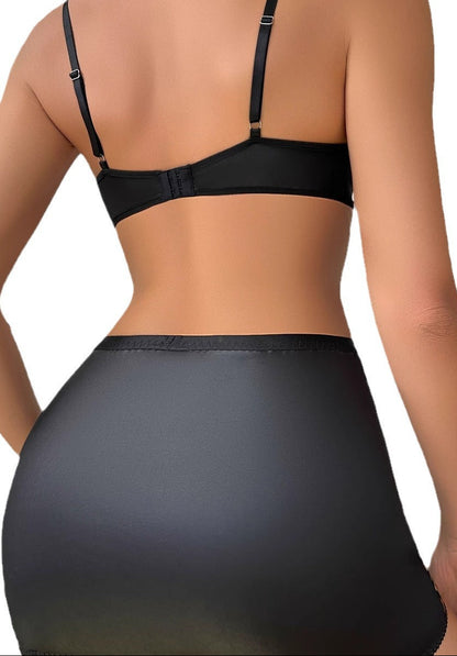 Close-up of cutout details and ribbon accents on the lingerie