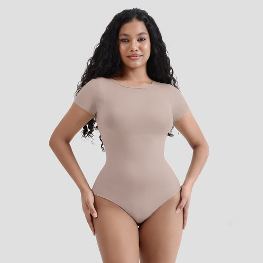 Plus size woman wearing body compression chest shaper jumpsuit