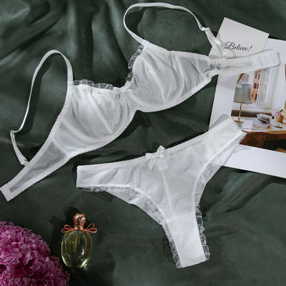 “Close-up of heart print detailing on seductive two-piece mesh lingerie”