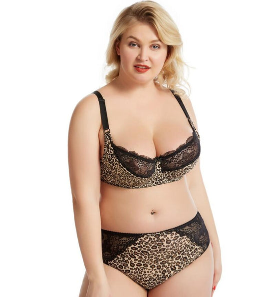 Plus size woman wearing leopard print lace bra and matching panty front view