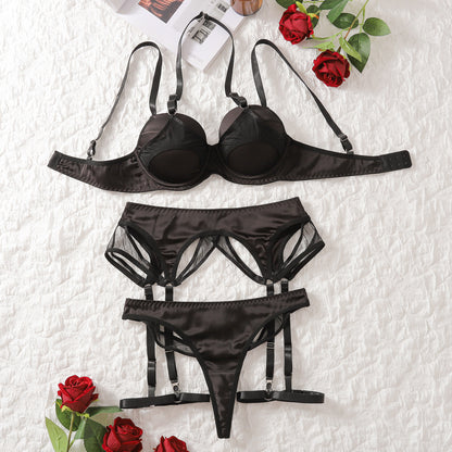 “Close-up of soft stretch material and details on four-piece lingerie set”
