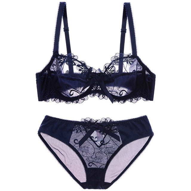 Close-up of floral embroidery on sheer mesh bra