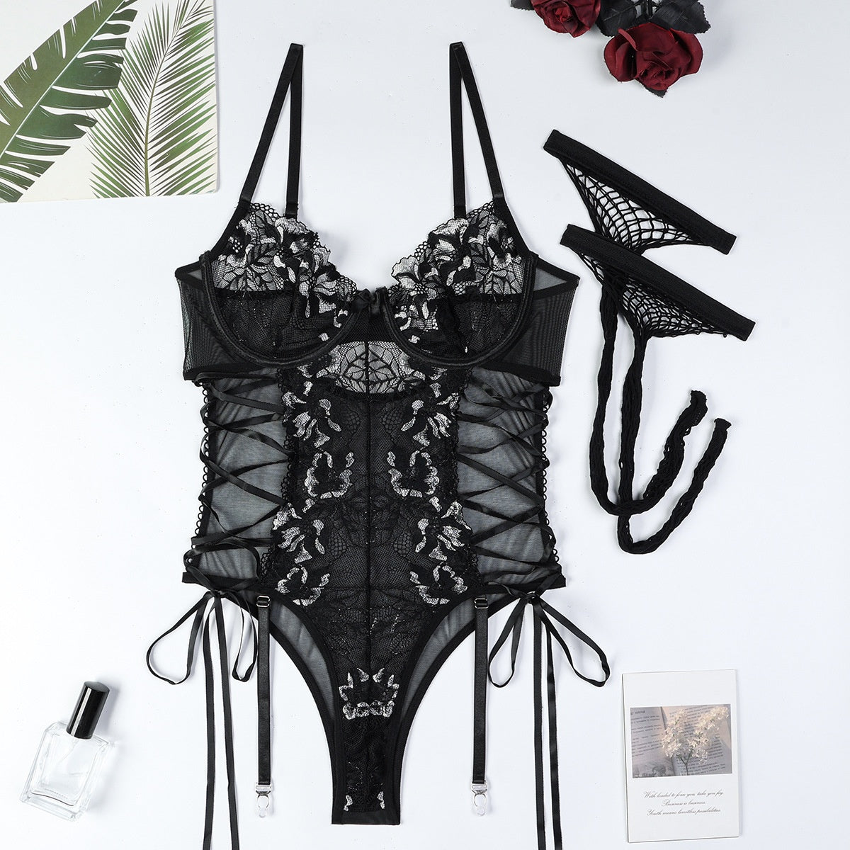 “Close-up of lace, hollow-out details, and steel ring accents on Muse jumpsuit”