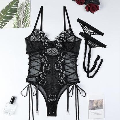 “Close-up of lace, hollow-out details, and steel ring accents on Muse jumpsuit”