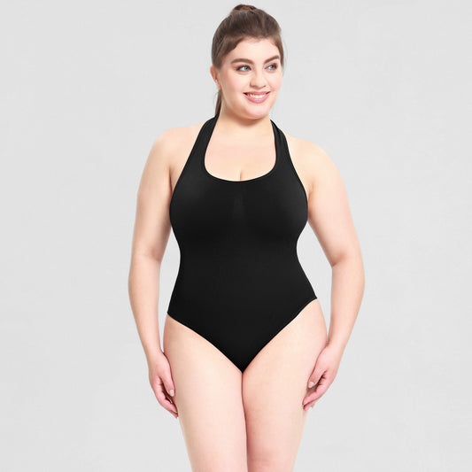Plus size woman wearing waist-cinching T-back shapewear bodysuit