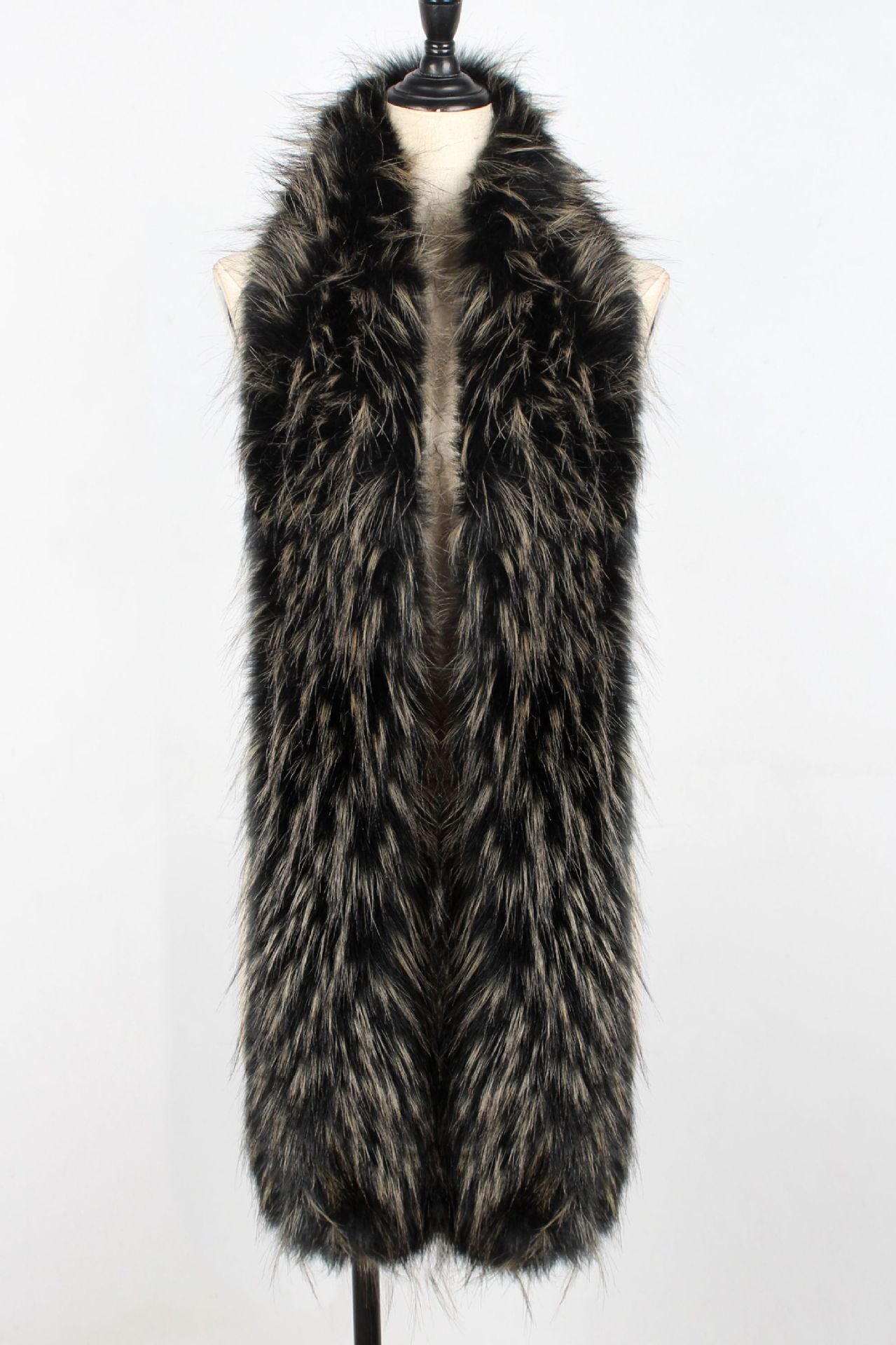 Fur vest on a mannequin against a white background