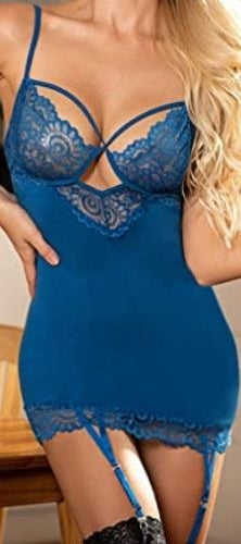 Woman wearing a blue lace lingerie set in a kitchen setting