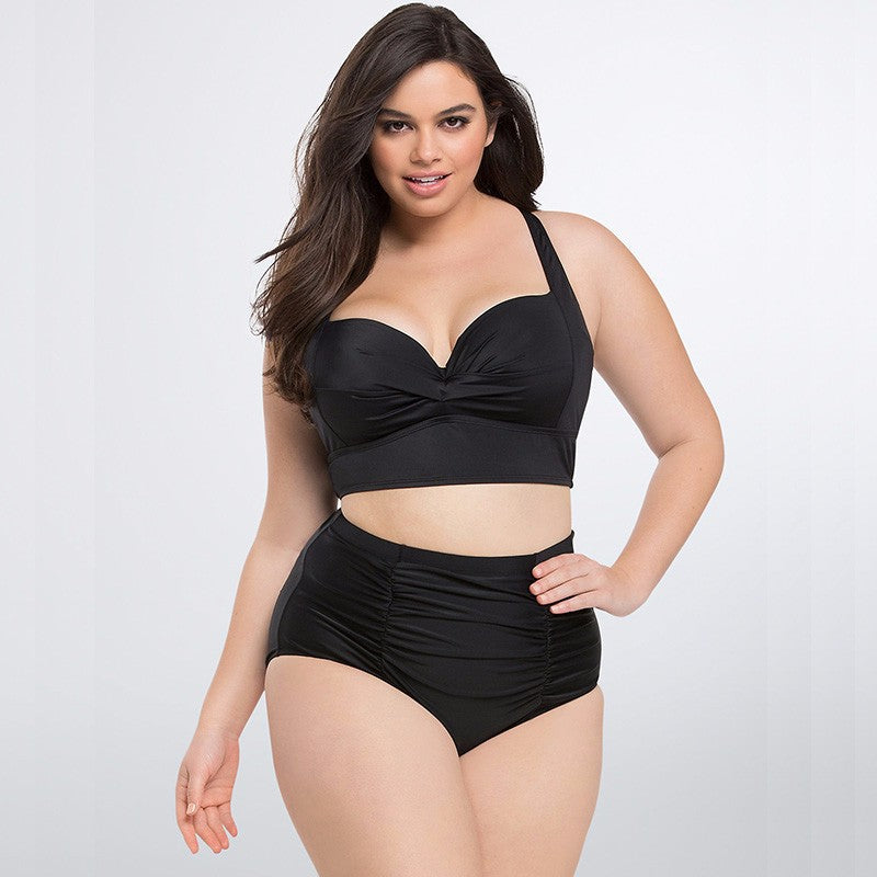Woman wearing a black swimsuit on a white background