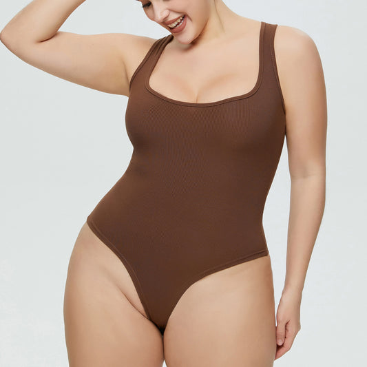 Plus size woman wearing ribbed jumpsuit with lace-up back