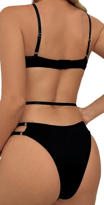 “Side view of black perspective one‑piece lingerie showing high‑cut leg and body‑hugging fit”