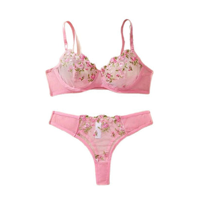Curvy woman wearing floral mesh transparent lingerie set