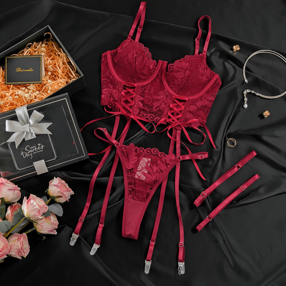 “Close-up of gathered lace detailing and adjustable straps on sexy red lingerie”