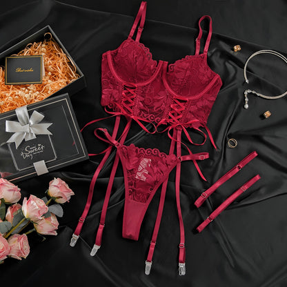 “Close-up of gathered lace detailing and adjustable straps on sexy red lingerie”