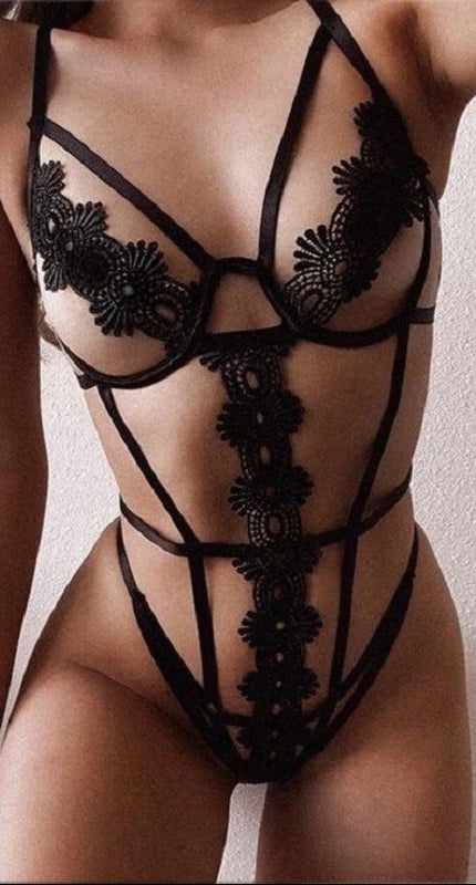 “Front view of halter neck lace bodysuit with revealing breast perspective tape”