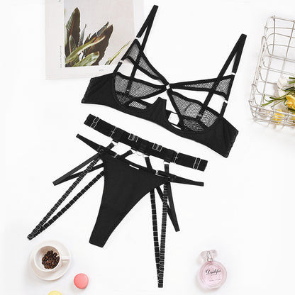 “Close-up of mesh fabric and steel ring gathering on three-piece lingerie set”