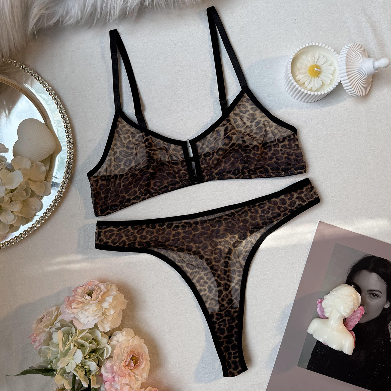 “Close-up of leopard print detailing and French bra design on erotic lingerie set”