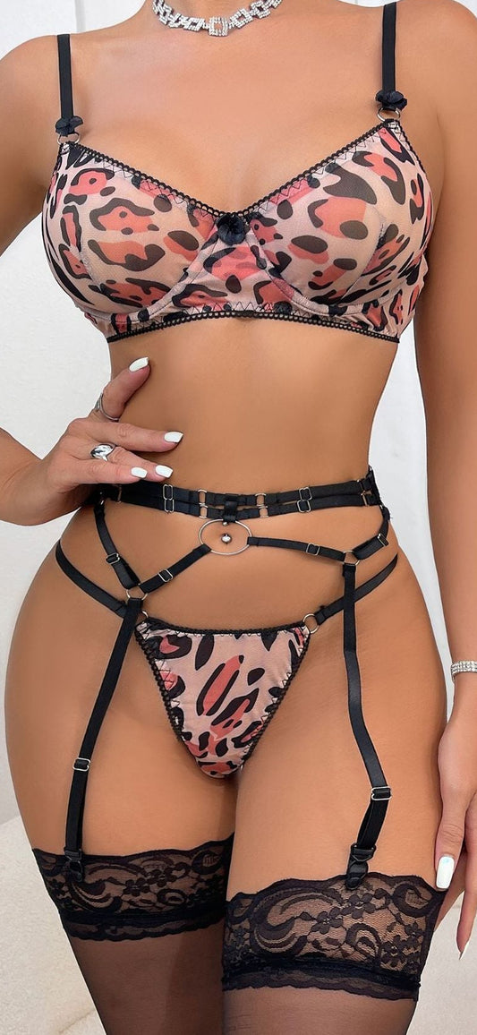 “Sexy leopard print three-piece lingerie set with sheer fabric and heavy detailing”