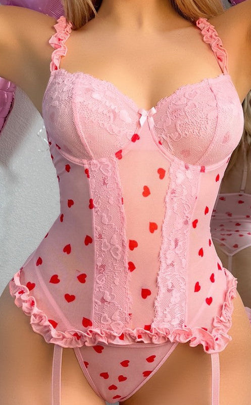 Woman wearing strapless lace bodysuit lingerie set with matching stockings