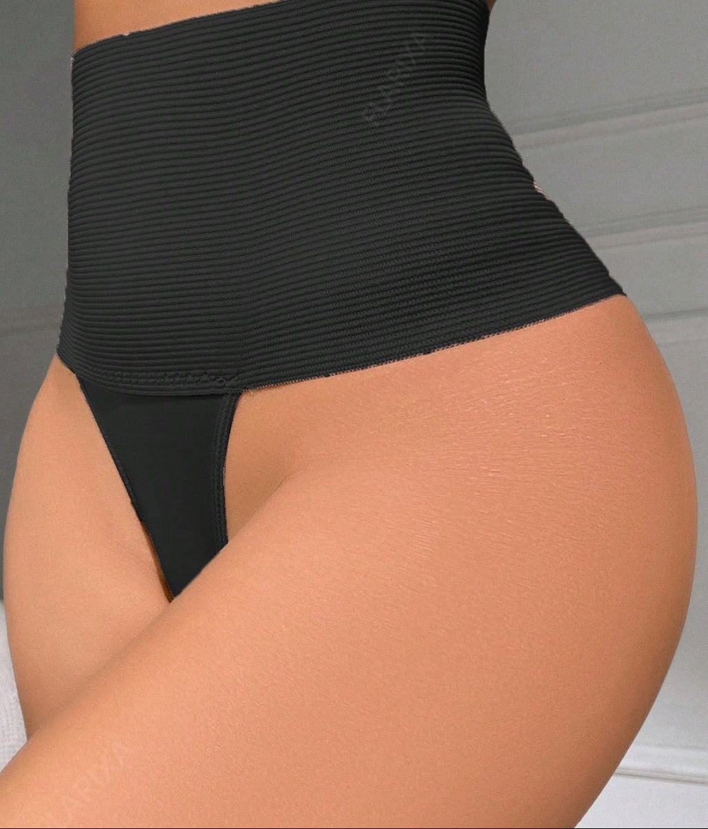 Plus size model wearing high waist tummy control thong