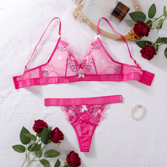 Plus size model wearing two-piece butterfly knot floral embroidery lingerie set
