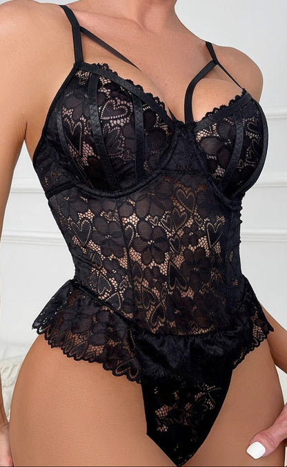 “Woman modelling sheer lace seduction one-piece bodysuit front view”