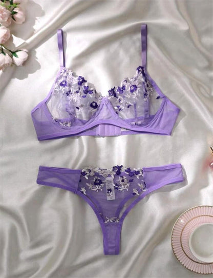 Sheer floral bralette with adjustable straps on mannequin