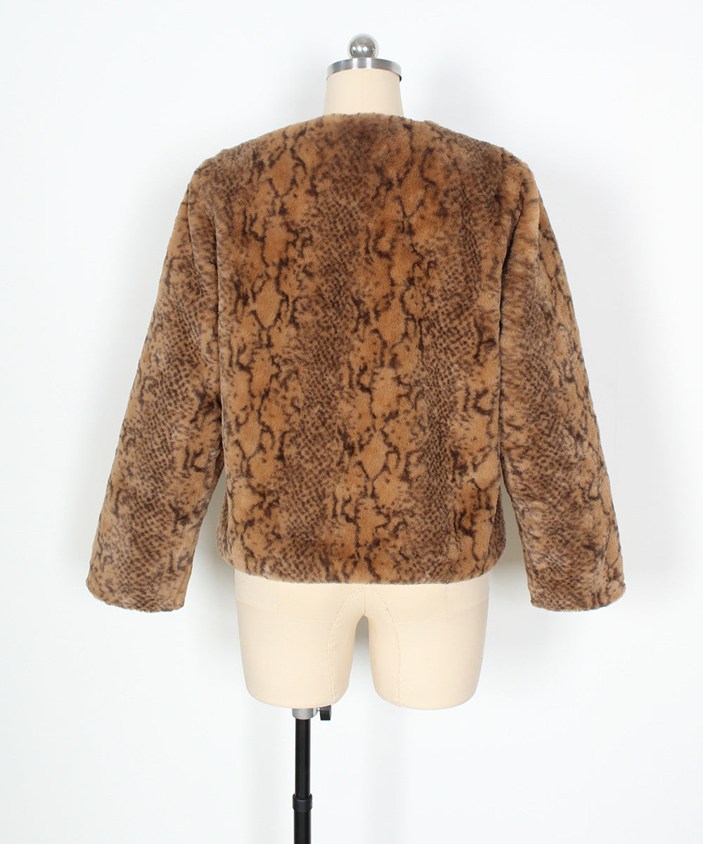 Brown snake print jacket on a mannequin against a white background