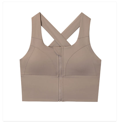 Beige sports bra with criss-cross back design on a white background