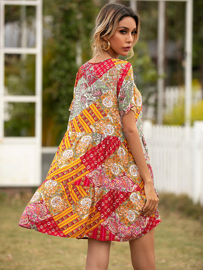 Woman wearing a colorful patterned dress outdoors