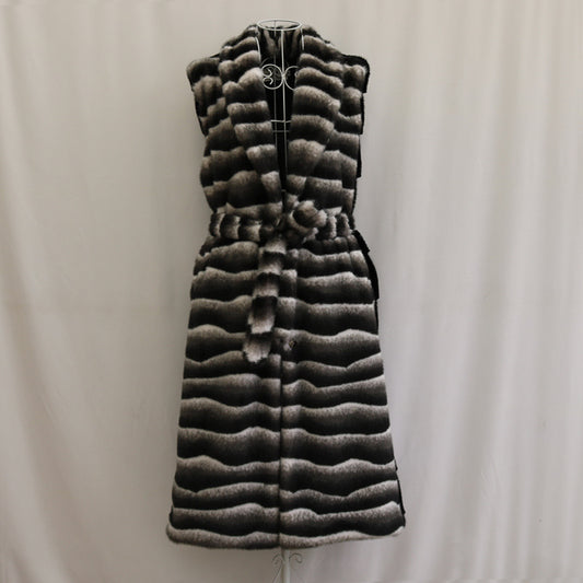 Long quilted vest with a pattern on a plain background