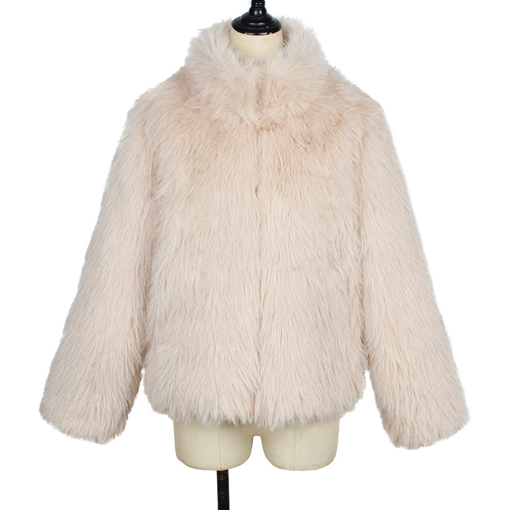 Beige fluffy jacket on a mannequin against a white background