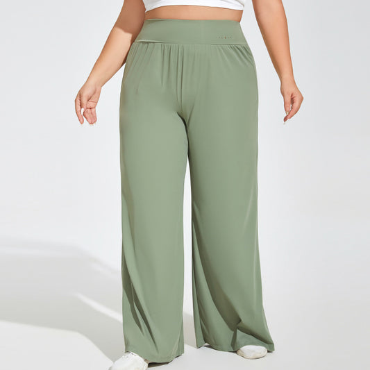 Green wide-leg pants worn by a person on a white background
