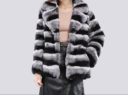 Close-up of soft plush faux mink fur on plus size short jacket