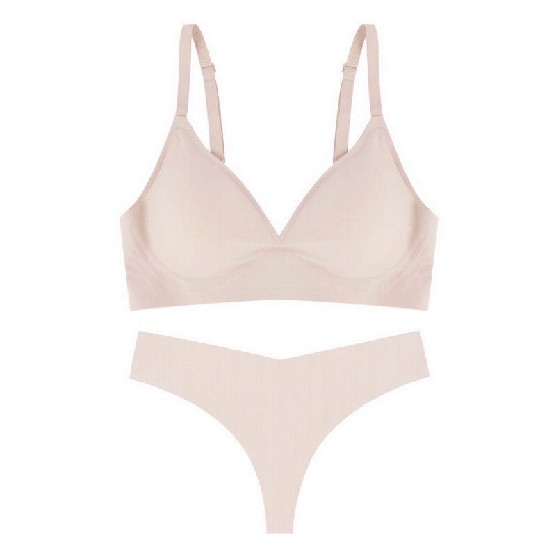 Beige bra and panties set on a white background