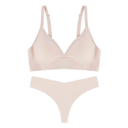 Beige bra and panties set on a white background