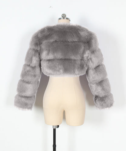 Gray fur jacket on a mannequin against a white background