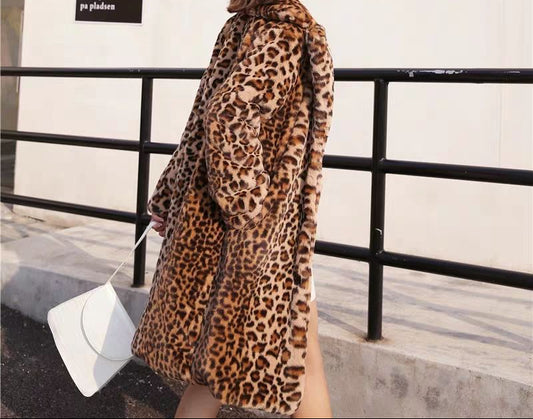 Woman wearing a leopard print coat in an urban setting