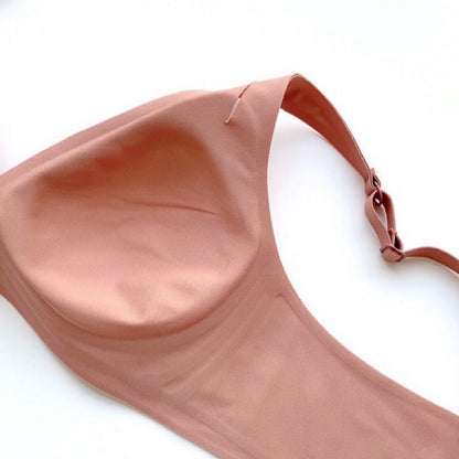 Rose gold bralette on a white background